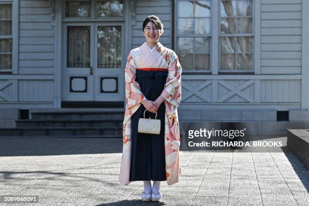 Japan's Princess Aiko, the daughter of Emperor Naruhito and Empress Masako, poses for the media on the grounds of Gakushuin University as she attends...