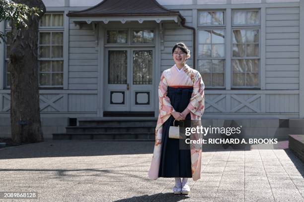 Japan's Princess Aiko, the daughter of Emperor Naruhito and Empress Masako, poses for the media on the grounds of Gakushuin University as she attends...