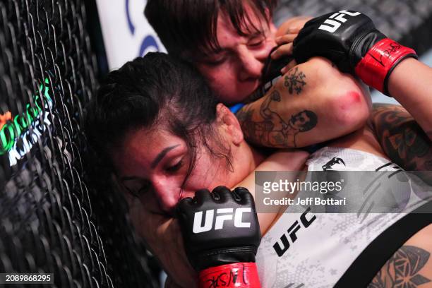 Macy Chiasson attempts to sub Pannie Kianzad of Iran in their women's bantamweight fight during the UFC Fight Night event at UFC APEX on March 16,...