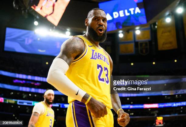 Los Angeles Lakers forward LeBron James reacts after scoring on a fast break layup against the Atlanta Hawks at Crypto.com Arena on March 18, 2024 in...