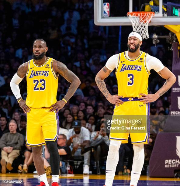 Los Angeles Lakers forward LeBron James and Los Angeles Lakers forward Anthony Davis stand down court during the game against the Atlanta Hawks at...