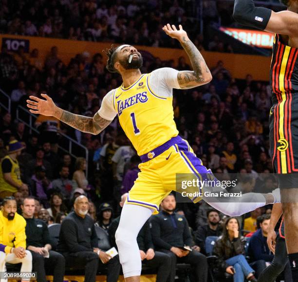 Los Angeles Lakers guard D'Angelo Russell watches his shot fall through the net after scoring on fall-away layup against Atlanta Hawks forward Bruno...