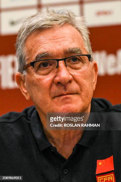 China's Croatian head coach Branko Ivankovic attends a press conference ahead of the 2026 FIFA World Cup qualifying football match between Singapore...