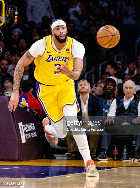 Los Angeles Lakers forward Anthony Davis charges after a loose ball against the Atlanta Hawks at Crypto.com Arena on March 18, 2024 in Los Angeles,...