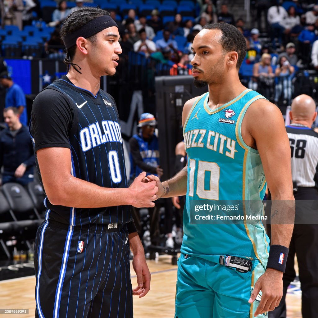 Amari Using Magic Anthony Black of the Orlando Magic and Amari Bailey of the Charlotte ...