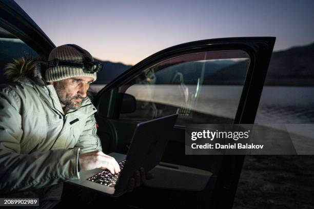 field biologist does ai driven research at night. - science and transportation committee stock pictures, royalty-free photos & images