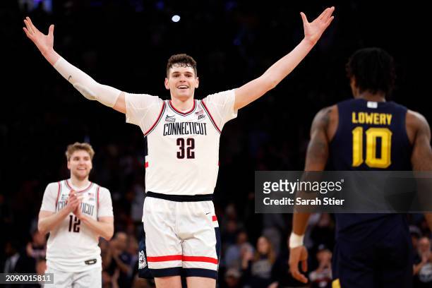 Donovan Clingan of the Connecticut Huskies reacts in the final seconds in the second half against the Marquette Golden Eagles during the Big East...