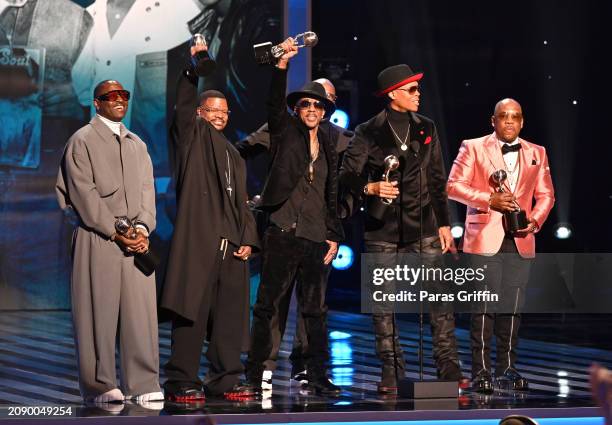 Johnny Gill, Ricky Bell, Ralph Tresvant, Bobby Brown, Ronnie DeVoe and Michael Bivins of New Edition speak onstage during the 55th NAACP Image Awards...