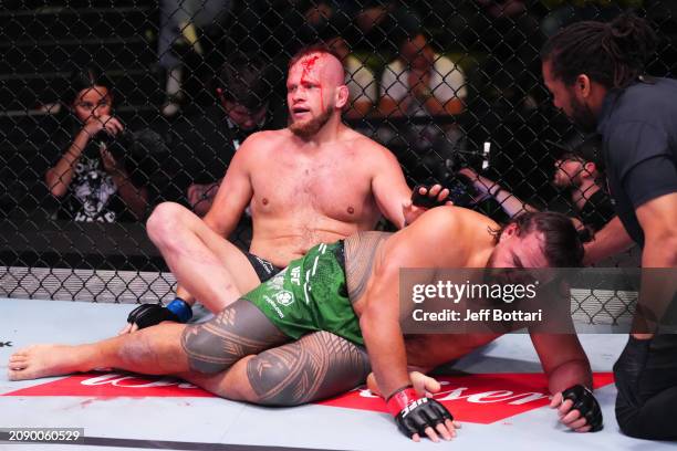 Marcin Tybura of Poland reacts after submitting Tai Tuivasa of Australia in their heavyweight fight during the UFC Fight Night event at UFC APEX on...