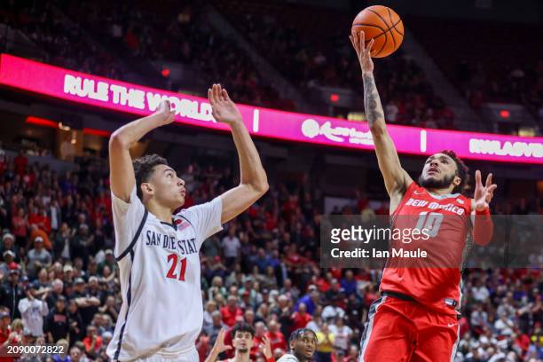 Jaelen House of the New Mexico Lobos shoots over Miles Byrd of the San Diego State Aztecs during the second half of the championship game of the...