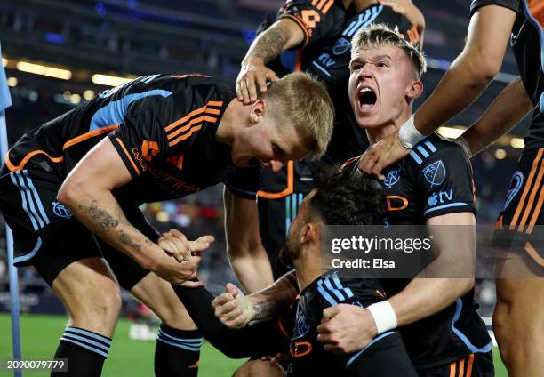 Kevin O'Toole of New York City FC is congratulated by teammates Keaton Parks and Mitja Ilenič after O'Toole scored the game winning goal during the...