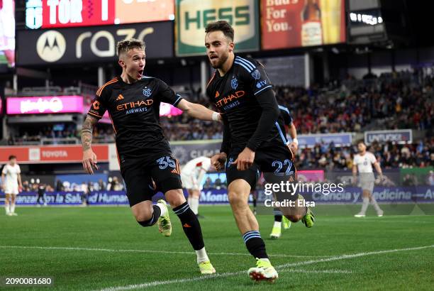 Kevin O'Toole of New York City FC is congratulated by teammate Mitja Ilenič after O'Toole scored the game winning goal during the second half at...