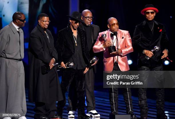 Johnny Gill, Ricky Bell, Ralph Tresvant, Bobby Brown, Ronnie DeVoe and Michael Bivins of New Edition speak onstage during the 55th NAACP Image Awards...