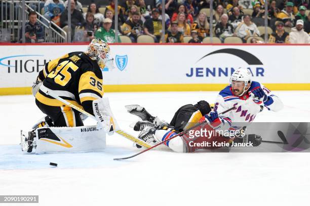 Vincent Trocheck of the New York Rangers takes shot against Tristan Jarry of the Pittsburgh Penguins at PPG PAINTS Arena on March 16, 2024 in...