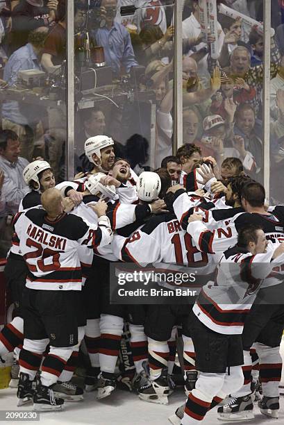 The New Jersey Devils celebrate their win over the Mighty Ducks of Anaheim in game seven of the 2003 Stanley Cup Finals at Continental Airlines Arena...