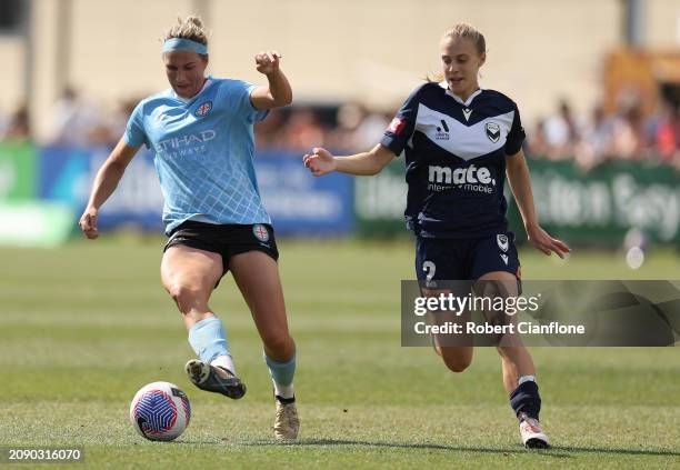 Hannah Wilkinson of Melbourne City is chased by Jamilla Rankin of the Victory during the A-League Women round 20 match between Melbourne Victory and...