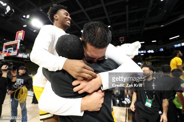 Jeffrey Yan of the Long Beach State 49ers celebrates with teammates after defeating the UC Davis Aggies in the championship game of the Big West...