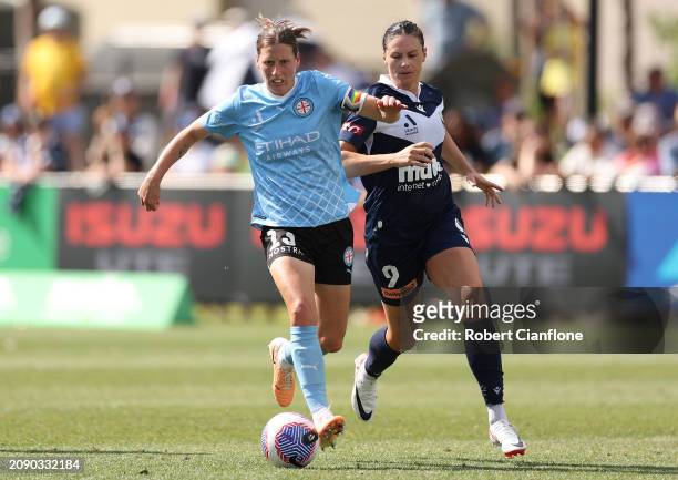 Rebekah Stott of Melbourne City is chased by Emily Gielnik of the Victory during the A-League Women round 20 match between Melbourne Victory and...