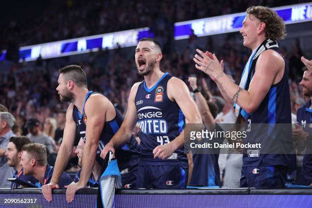 Chris Goulding of United celebrates with Matthew Dellavedova of United and Luke Travers of United during game one of the NBL Championship Grand Final...