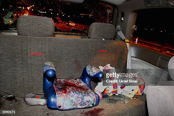 Blood stains the interior of a bullet-ridden car after a 7-year-old Israeli girl was killed in a shooting attack by suspected Palestinian gunmen June...