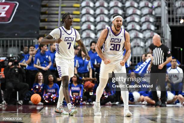 Tyon Grant-Foster and Gabe McGlothan of the Grand Canyon Antelopes react to a play against the Texas-Arlington Mavericks in the second half of the...