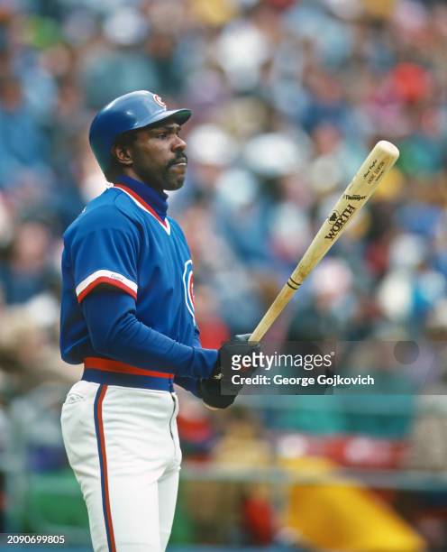 Andre Dawson of the Chicago Cubs holds his Worth Thumper Andre Dawson model bat before batting against the Pittsburgh Pirates during a Major League...