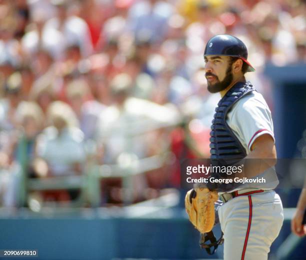 Catcher Ozzie Virgil, Jr., of the Atlanta Braves looks on from the field during a game against the Pittsburgh Pirates at Three Rivers Stadium in 1987...