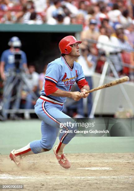 Darrell Porter of the St. Louis Cardinals bats against the Pittsburgh Pirates during a Major League Baseball game at Three Rivers Stadium in 1982 in...