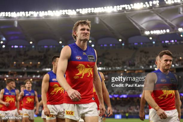 Harris Andrews of the Lions leads the team from the field after being defeated during the round one AFL match between Fremantle Dockers and Brisbane...