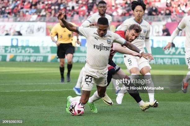 Cavric of Kashima Antlers and Jesiel of Kawasaki Frontale compete for the ball during the J.LEAGUE MEIJI YASUDA J1 4th Sec. Match between Kashima...