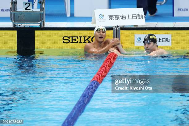 Daiya Seto reacts with Masato Sakai after competing in the Men's 200m Butterfly Heat during day four of the Swimming Olympic Qualifier at Tokyo...