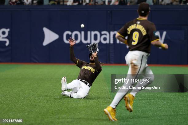 Fernando Tatis Jr. #23 of the San Diego Padres dives to catch the fly in the 5th inning during the exhibition game between Team Korea and San Diego...