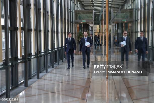 France's Prime Minister Gabriel Attal and France's Deputy Minister for Public Accounts Thomas Cazenave arrive to hold a press conference to present...