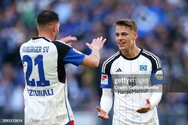 Miro Muheim of Hamburger SV celebrates scoring his team's first goal with teammate Levin Oeztunali during the Second Bundesliga match between...
