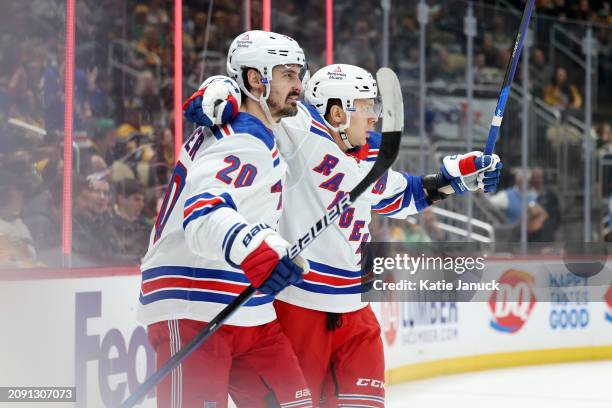 Artemi Panarin and Chris Kreider of the New York Rangers celebrate goal against the Pittsburgh Penguins at PPG PAINTS Arena on March 16, 2024 in...