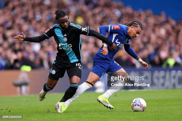 Stephy Mavididi of Leicester City battles for possession with Malo Gusto of Chelsea during the Emirates FA Cup Quarter Final between Chelsea FC and...