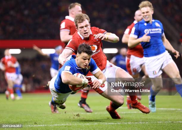 Lorenzo Pani of Italy dives to score his team's second and eventual winning try during the Guinness Six Nations 2024 match between Wales and Italy at...
