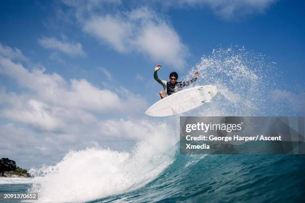 young man surfs wave - cabarete stock pictures, royalty-free photos & images