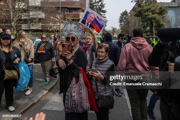 Pro Putin supporters stand in front of the Russian consulate on March 17, 2024 in Milan, Italy. Russian citizens who do not support Vladimir Putin...