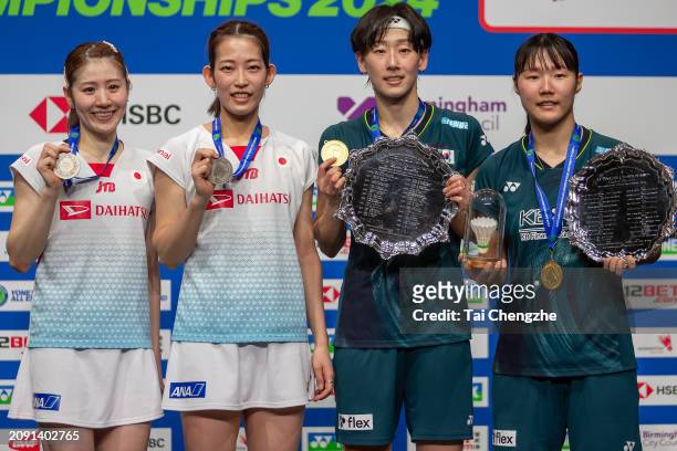 Silver medalists Chiharu Shida and Nami Matsuyama of Japan, gold medalists Lee So-hee and Baek Ha-na of South Korea celebrate on the podium following...