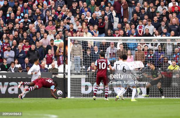 Michail Antonio of West Ham United scores his team's first goal as Emiliano Martinez of Aston Villa fails to make a save during the Premier League...