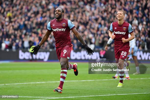 Michail Antonio of West Ham United celebrates scoring his team's first goal during the Premier League match between West Ham United and Aston Villa...