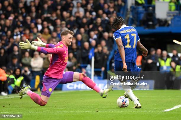 Carney Chukwuemeka of Chelsea scores his team's third goal past Jakub Stolarczyk of Leicester City during the Emirates FA Cup Quarter Final between...