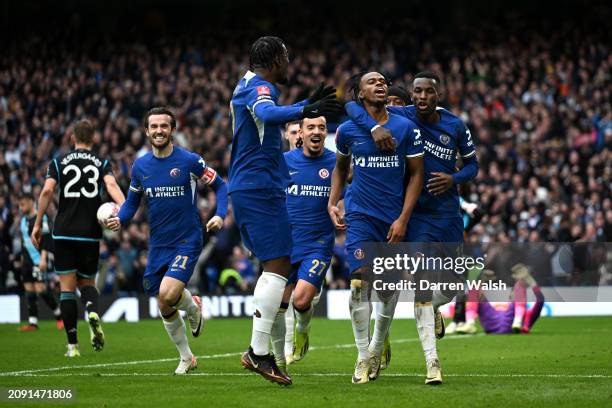 Carney Chukwuemeka celebrates with teammates Ben Chilwell, Malo Gusto and Nicolas Jackson of Chelsea after scoring his team's third goal during the...