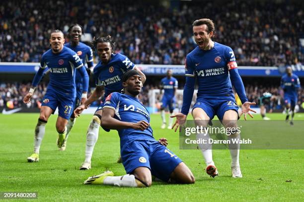 Noni Madueke celebrates with Ben Chilwell of Chelsea scoring his team's fourth goal during the Emirates FA Cup Quarter Final between Chelsea FC and...