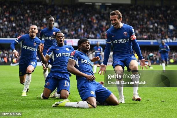 Noni Madueke celebrates with Ben Chilwell and Carney Chukwuemeka of Chelsea after scoring his team's fourth goal during the Emirates FA Cup Quarter...