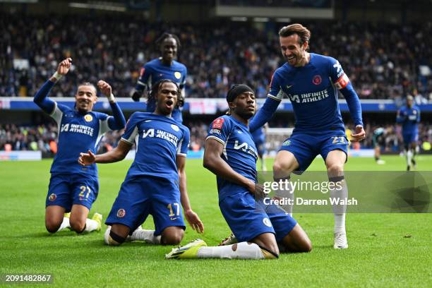 Noni Madueke celebrates with Ben Chilwell and Carney Chukwuemeka of Chelsea after scoring his team's fourth goal during the Emirates FA Cup Quarter...