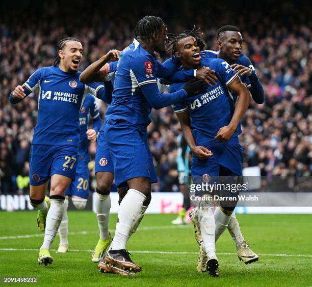 Carney Chukwuemeka celebrates with teammates Malo Gusto, Nicolas Jackson and Axel Disasi of Chelsea after scoring his team's third goal during the...