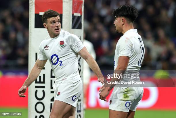 George Ford of England talks to team mate Marcus Smith during the Guinness Six Nations 2024 match between France and England at Groupama Stadium on...