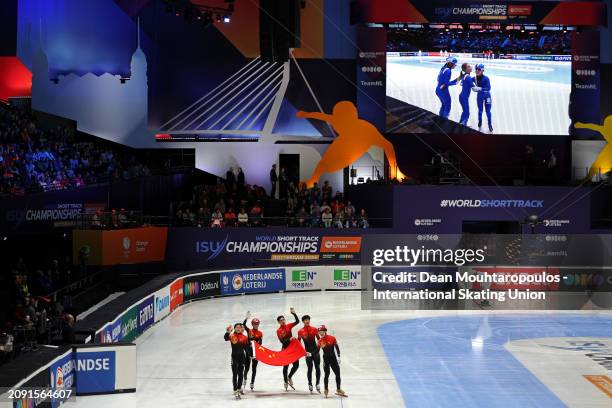 Kexin Fan, Li Gong, Xiaojun Lin and Shaoang Liu of China celebrate winning after they compete in the Mixed Team Relay Final A during ISU World Short...